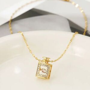 Gold Perfume Bottle with Dancing Diamond In Motion